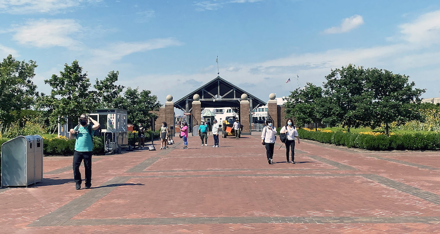 Social distancing with masks at the Statue of Liberty for coronavirus safety