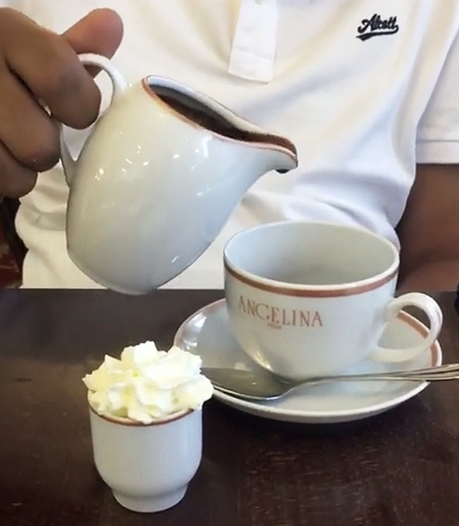 Pouring hot chocolate at Angelina at Versailles near Paris