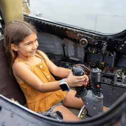 Girl-playing-inside-an-exhibit-at-the-USS-Midway-Museum-768×512