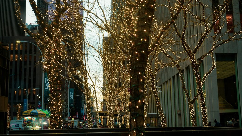 New York City street with lights on trees