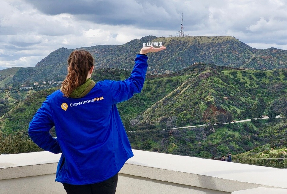 Tour Guide posing with Hollywood Sign in Griffith Park