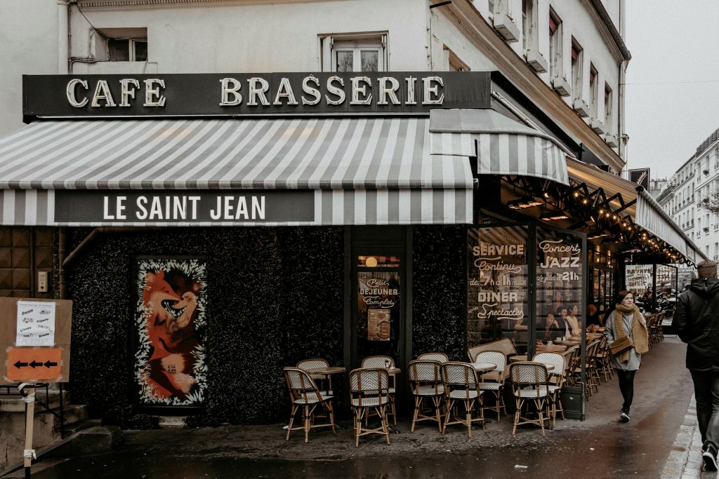 Black and white restaurant with chairs and tables in Paris