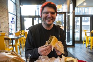 Tour Guide eating during Chicago Food and Culture Tour