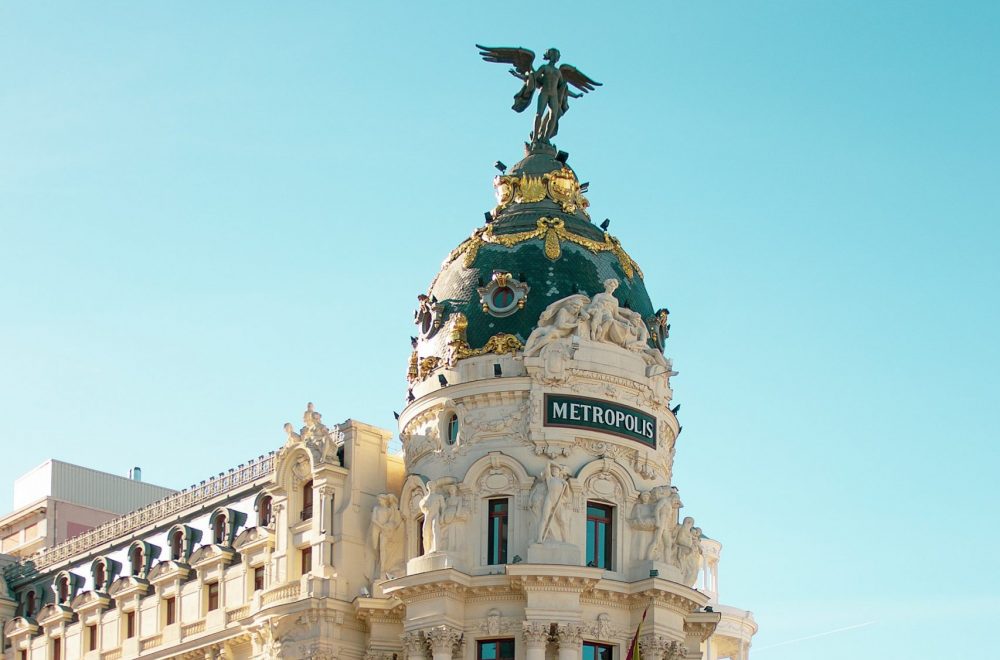 Metropolis building in Madrid seen on small group bike tour