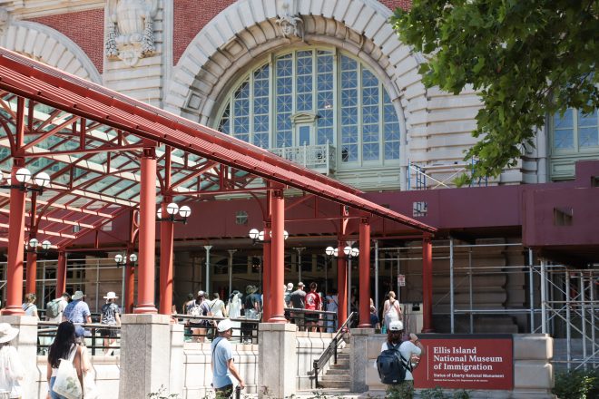 Close up of Ellis Island entrance on a sunny day during Statue of Liberty tour