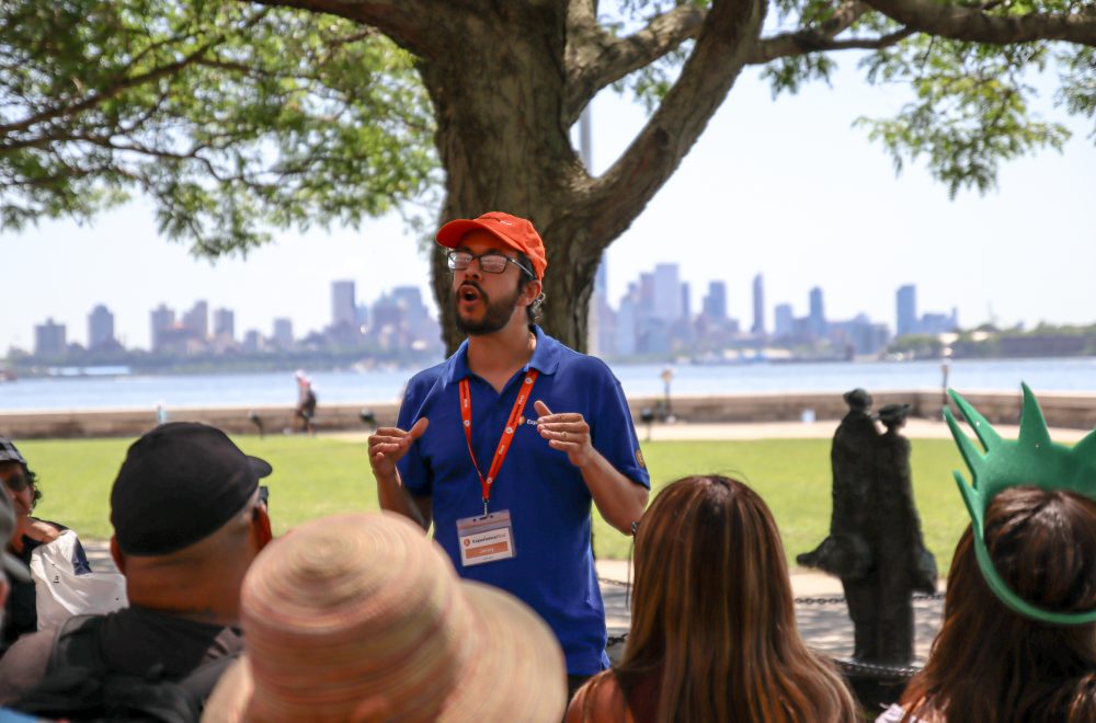 Focused shot of ExperienceFirst tour guide talking to tour group