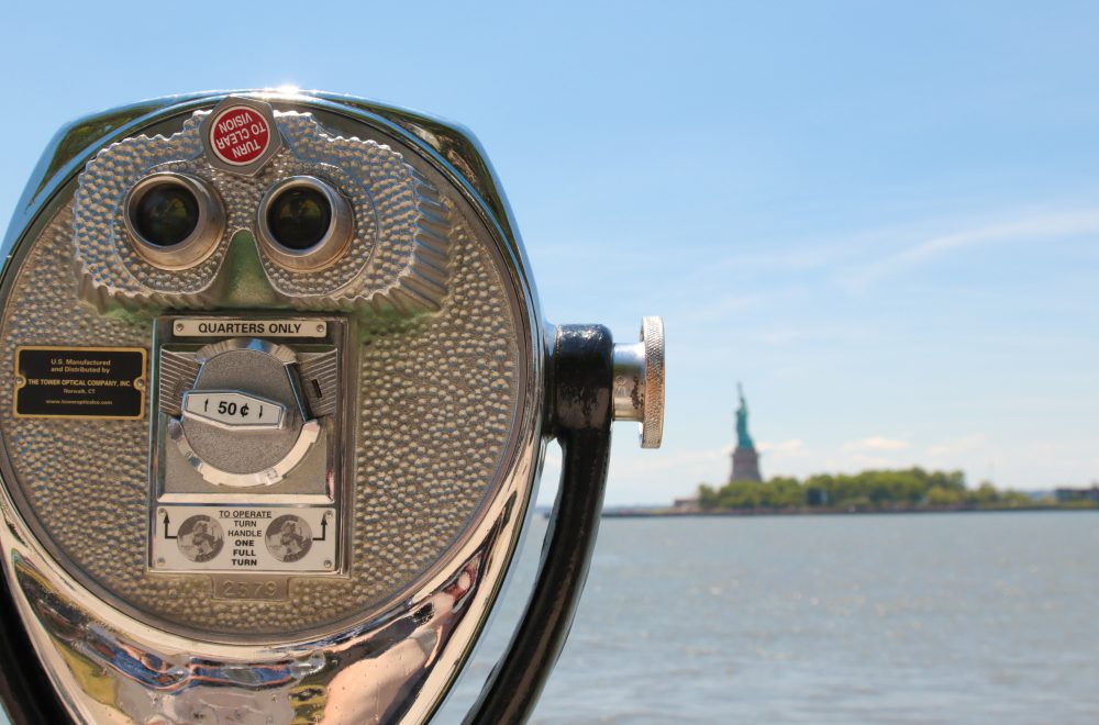 Tower viewer with Statue of Liberty in the background during Statue of Liberty and Ellis Island tour