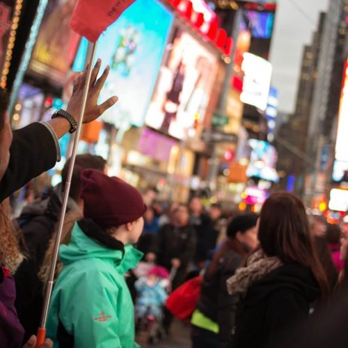 Guide giving Time Square tour