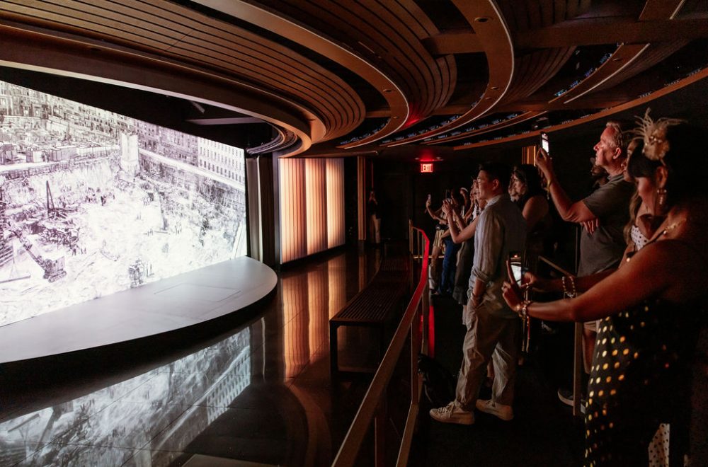 Visitors taking photos at the Welcome Gallery in Rockefeller Center