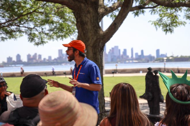 Tour Guide talking to group during Statue of Liberty and Ellis Island tour