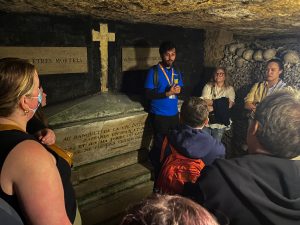 Guide explaining artifact during Catacombs Guided Tour