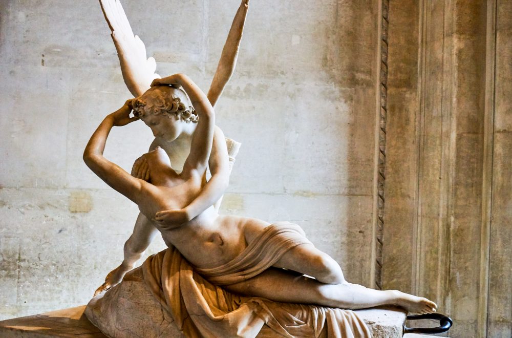 louvre sculpture of angel and woman kissing