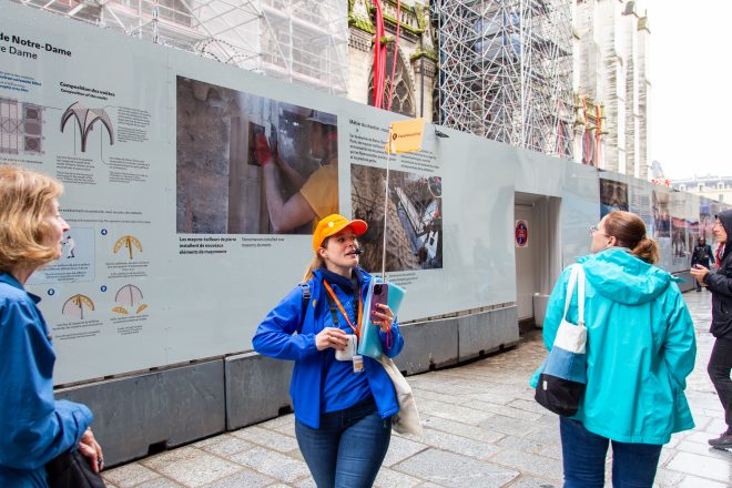 Tour Guide explaining to guests during Notre Dame Outdoor Walking Tour