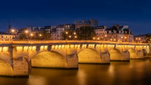 Pont Neuf Bridge Near Apartment Buildings Under Night Sky in Paris Ghost Tour