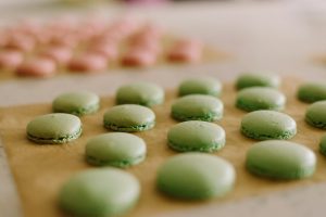 Focus shot of macaron shells on baking paper