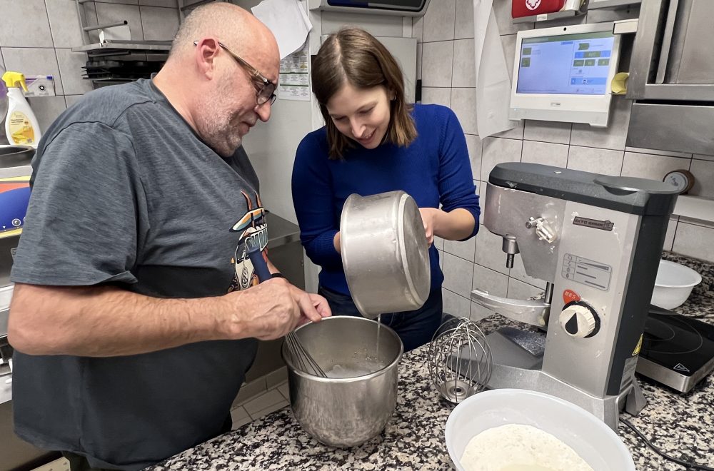 Guests pouring ingredients into bowl