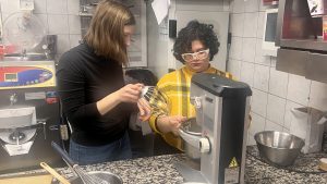 Guests setting up automatic mixer during Paris macaron baking class